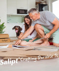 Couple assembling furniture with dog in room full of Salipt packaging, enjoying DIY process at home.