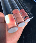 Crystal Clear Acrylic Stair Handrail Built Like A Tank With Corrosion Resistant Brackets For Quick Wall Mounting and Serious Non Slip Grip. Handheld acrylic tubes showcase different widths.