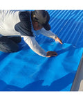 Worker installing Heavy Duty Waterproof Roofing Felt Tape Self Adhesive Asphalt Shingle Repair Roll on a roof surface.