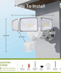 Lit 72W LED Security Flood Light With Motion Sensor, 7400 Lumen Aluminum Outdoor Light installed on a wall, showing three adjustable heads.