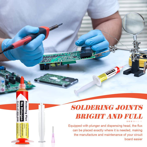 Using No Clean Solder Flux Paste Kit 4 Pack With 10ml Tubes for precise soldering on a circuit board with tools on table.