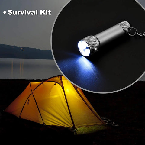 Set Of 30 Mini LED Keychain Flashlights With 5 Bulbs, Ultra Portable Pocket Lights For Camping shown near a lit tent