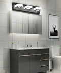 Three Light Black Vanity Lighting Fixture With Acrylic Shades, modern LED bathroom wall light above mirror on black metal frame.