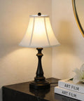Table lamp from Three Piece Vintage Style Lamp Set with bronze finish and brown fabric shade on marble surface
