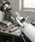 Top Rated 6 Piece Pipe Threading Tool Kit For Pvc cutting PVC pipe with high carbon steel cutter attached to electric drill.