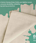 Must Have Canvas Drop Cloth For Painting 4x5 Feet Pack Of 1 8oz Painter Drop Cloths All Purpose Tarps folded corner on green paint splatter