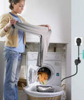 Woman using No Fuss Dryer Plug Converter Adapter 14-30R Female To 10-30P Male With Ground Wire in laundry room.