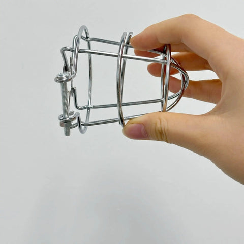 Pair Of Badass Fire Sprinkler Head Guards Made From Rust Resistant Stainless Steel Heavy Duty Cage Covers For One Half And Three Quarter Inch Systems shown in hand.
