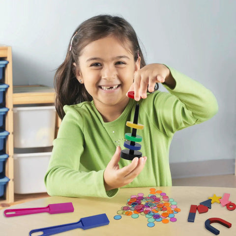 Child playing with 122 Piece Magnetic Science Kit For Kids With Colorful Chips, Magnetic Balls, Wands, Magnets, And Rings