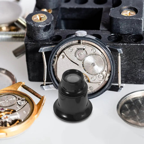 Five Piece Jewelers Loupe Set With Holder 3X 5X 10X 15X 20X Monocular Magnifiers shown with watch parts and black stand.
