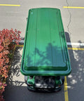 Four Seater Electric Golf Cart With Full Led Lighting And Tuned Independent Suspension Crafted For Chill Night Cruises Weekend Patrols Top Shelf Comfort And Sure Grip Tires In Green, top view on asphalt.