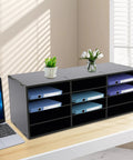 12 Slot Mail Sorter Organizer Desk File Holder with top platform, black PVC, on office desk holding folders and plant. Space saver for home or office.