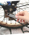 Grab This 8 Piece Small Compression Spring Kit With Hook Ends Perfect For Elevating Electric Vehicle Parking Stands And Securing Ladder Foot Supports To Keep Your Gear Rock Solid And Ready For Any Adventure. silver hook-end compression springs on a bike wheel