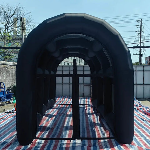 Black Portable Batting And Pitching Cage Tent, 20 Ft Long By 10 Ft Wide By 10.5 Ft High, displayed outdoors on striped mat.