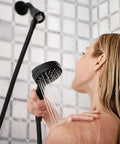 Person using Engage Magnetix Eco Performance Handheld Showerhead With Magnetic Docking System, Matte Black in shower