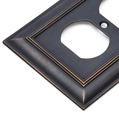 Decorative 1-Gang Duplex Wall Plate 3-Pack In Oil Rubbed Bronze Finish, close-up corner view showing zinc alloy detail