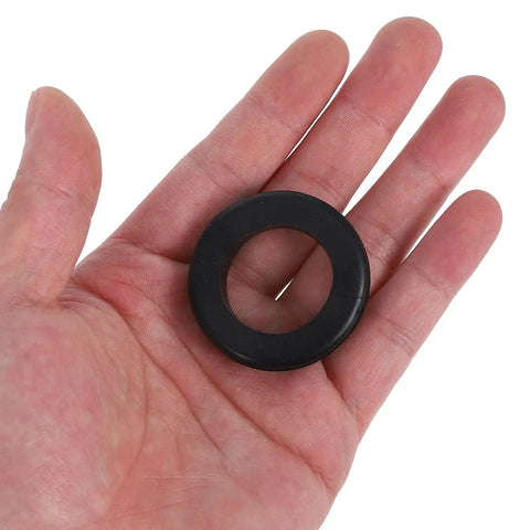 Black rubber cable grommet in hand from Six Piece Black Rubber Cable Grommet Kit For Wire Entry Holes That Improves Cable Routing And Protection With Durable Rubber Grommets For Safer Tidier Setups And Cable Damage Prevention.