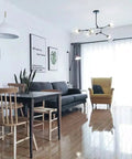 Living room featuring a 60 Watt Modern Elegance White Pendant Light Fixture with industrial metal shade and minimalist design.