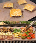 Copper Grill Mats Set Of 5 Nonstick Reusable BBQ Mats For Electric Gas Charcoal Grills Grilling Made Easy With Simple Clean As Seen On TV 15.75 Inch By 13 Inch Outdoor Grill Accessories in use with vegetables and burgers with cheese