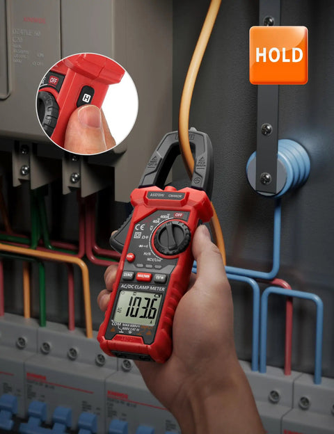 Digital Clamp Meter Multimeter With Auto-Ranging 4000 Counts For AC And DC Voltage And Current, Resistance, Capacitance, Frequency, Duty Cycle, Diode, Continuity, Live Wire NCV Test, Non Contact Voltage Detection, Pro Grade Tool For Pros And DIY red clamp meter on electrical panel with hold button