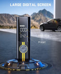 X8 APEX EV Tire Inflator Portable Air Pump with large digital screen for real-time and preset PSI, parked car in background