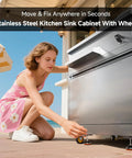 Woman adjusting Stainless Steel Outdoor Kitchen Sink With Faucet Kit Hose Hookups Single Bowl Storage Brakes On Wheels Spice Rack All Weather Use Built To Last For RV Yard Garage Restaurants on patio