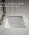 Roomy Rectangular Undermount Bathroom Sink With Overflow Drain Crafted From Hella Durable Vitreous China For An Easy Vanity Setup Bringing Straight Up White Finish and Overflow drain holes visible.