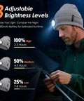 Man wearing LED Beanie With Built-In USB Rechargeable Light For Men And Women, adjusting tent with visible brightness levels