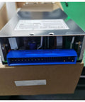 Rock Solid Compact Din Rail Power Supply For Industrial Automation And Communications Gear with blue connection port and metal casing.