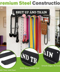 Built Like A Tank Wall Mounted Workout Gear Organizer Rack With Eight Heavy Duty Hooks For Hanging Barbells Resistance Bands Jump Ropes And Belts In Garage Or Home Gyms, featuring heavy-duty steel and vibrant resistance bands.