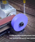 Badass Electric Knife Sharpener And Wet Bench Sander Featuring Ten Tough Sand Belts Plus Polishing And Grinding Wheels, close-up of crystal corundum grinding wheels.