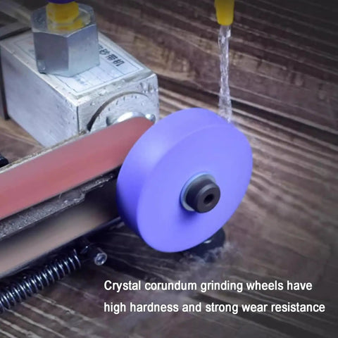 Badass Electric Knife Sharpener And Wet Bench Sander Featuring Ten Tough Sand Belts Plus Polishing And Grinding Wheels, close-up of crystal corundum grinding wheels.