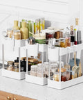 Super Slick 3 Pack Under Sink Organizer With Bonus Hanging Cups For Bathroom And Cabinet Storage in clean white finish with various items.