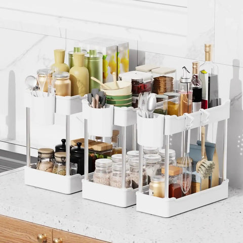 Super Slick 3 Pack Under Sink Organizer With Bonus Hanging Cups For Bathroom And Cabinet Storage in clean white finish with various items.