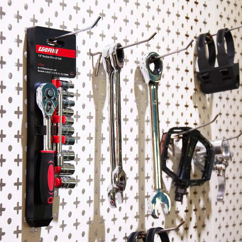 Compact Quarter Inch Drive Ratchet Socket Set with Ten Metric Sockets on garage pegboard