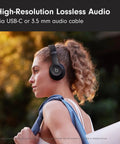 Solo 4 Wireless Bluetooth On-Ear Headphones Serving Serious Heat And 50-Hour Battery Life For Your Daily Ride Built With Ultra Lightweight Flex-Grip Cushions And Immersive Spatial Audio Technology In Matte Black on a woman wearing them outside.