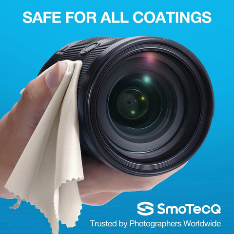 SmoTecQ microfiber cleaning cloth on a camera lens; beige fabric, close-up view