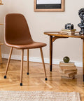 Chair with 20 Piece Chair Leg Protectors With Iron Washers And Shockproof Rubber Caps installed on wooden floor, in living room.