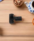 4 Pack Quick Install Childproof Refrigerator Locks, ABS plastic lock on wooden table, surrounded by coffee and nuts, safe home solution