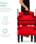 Person folding red foldable outdoor utility wagon with canopy for beach, picnic, camping, tailgates removable shade, 150 lb capacity.