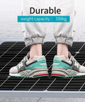 Person standing on Straight Up Plug And Play 1440W Off Grid Solar Panel Kit 24V complete system demonstrating durability.