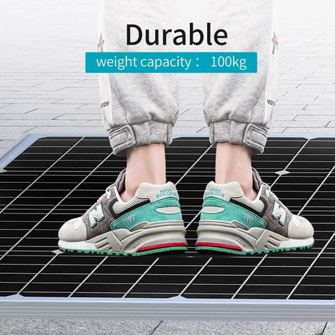 Person standing on Straight Up Plug And Play 1440W Off Grid Solar Panel Kit 24V complete system demonstrating durability.