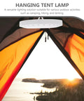LED Camping Lantern Round Waterproof Portable Tent Light for Hiking and Emergencies under an orange tent during sunset