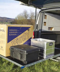 Rock Solid Heavy Duty Fully Extending Drawer Slides Featuring Beefy Carbon Ball Bearings And Secure Latch Mechanism For Ultra Smooth Household And Garage Installations with neat boxes in a van.