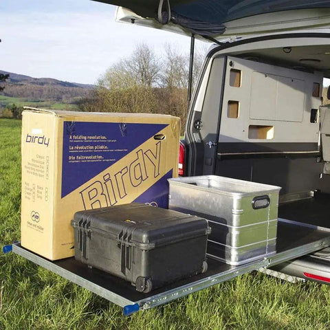 Rock Solid Heavy Duty Fully Extending Drawer Slides Featuring Beefy Carbon Ball Bearings And Secure Latch Mechanism For Ultra Smooth Household And Garage Installations with neat boxes in a van.