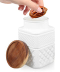 Solid Airtight Glass Food Storage Canisters With Matte White Sealed Lids To Keep Your Coffee Beans Tea Sugar And Grains Hella Crisp While Serving Major Kitchen Vibes For Effortless Pantry Organization Daily, hand adding nuts.