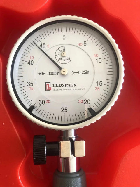 Front view of LLDSIMEX dial bore gauge with white dial, 0.7–1.5 in range, 0.0005 in graduations