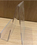 Heavy Hitter Hot Acrylic Bending Machine For Pvc And Plastic Sheets With Adjustable Heat And Water Cooling Smooth Double Fold Design That Makes Sharp Curves A Walk In The Park For Diy Makers And Hobbyists Up To Sixty Cms display base showing a clear acrylic stand on a wooden surface.