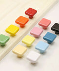 Colorful variety of ceramic square knobs in 1.25 inch size, showcasing vibrant design options for kitchen and dresser cabinets.