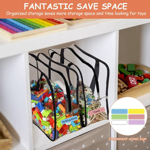 Six Pack Large Clear PVC Toy Storage Bags with Labels holding building blocks and puzzles on shelf in playroom.